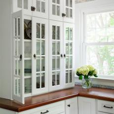 Glass Front Kitchen Cabinets and Flowers