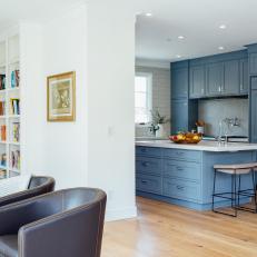 Blue Open Plan Kitchen and Leather Chairs