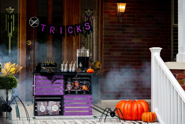 Turn an old lemonade stand into a creepy self-serve candy bar this Halloween.