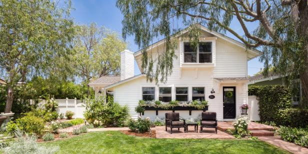 Charming Cottage Home With White Fence