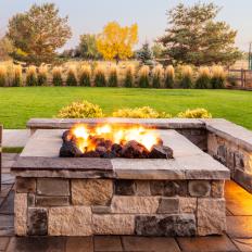 Backyard Patio Features Custom Stone Firepit 