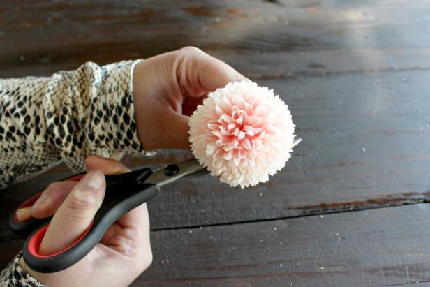 Remove any undesired leaves or stems from the faux flowers (Image 1 + 2). Many faux flowers pull apart at certain points, but you may need to use scissors or wire-cutters. On single-stem flowers, make sure to leave 2-3 inches of the stem intact so the zip ties have something to hold onto when attaching them to the boxwood panels (Image 3).