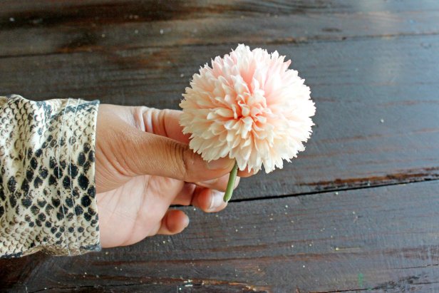 Remove any undesired leaves or stems from the faux flowers (Image 1 + 2). Many faux flowers pull apart at certain points, but you may need to use scissors or wire-cutters. On single-stem flowers, make sure to leave 2-3 inches of the stem intact so the zip ties have something to hold onto when attaching them to the boxwood panels (Image 3).