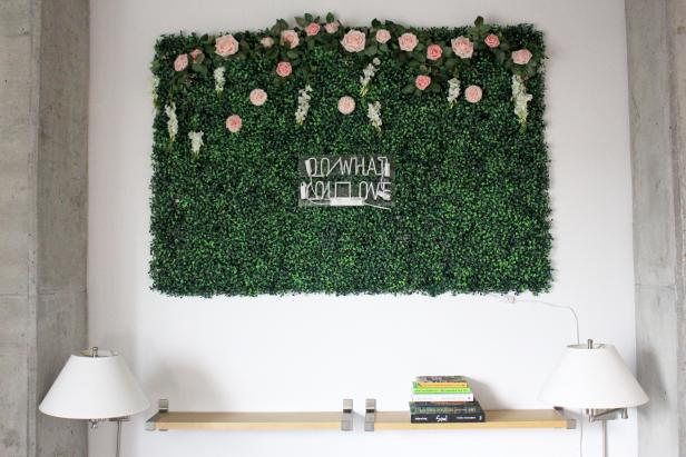 With your neon sign and its cording secured to the wall, connect and then mount the final boxwood panels. If you notice any panels are slightly puckering or coming off the wall, add more nails or hooks to fully secure.Finally, turn on your neon sign and enjoy your new wall hanging.