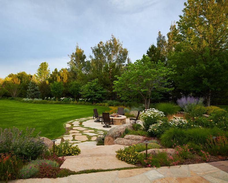 Firepit Patio in Expansive Green Backyard