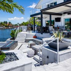 Waterfront Backyard With Terraced Patios