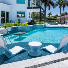 Swimming Pool With White Lounge Chairs