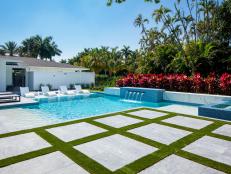 Lattice and Grass Walkway Beside Modern Pool and Spa in Florida Yard