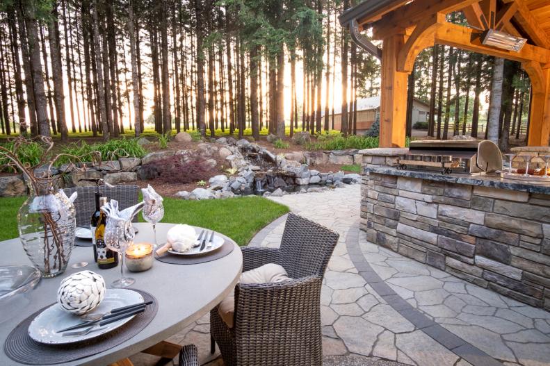 Outdoor Dining at Wicker Chairs, Table, View of Trees, Covered Patio