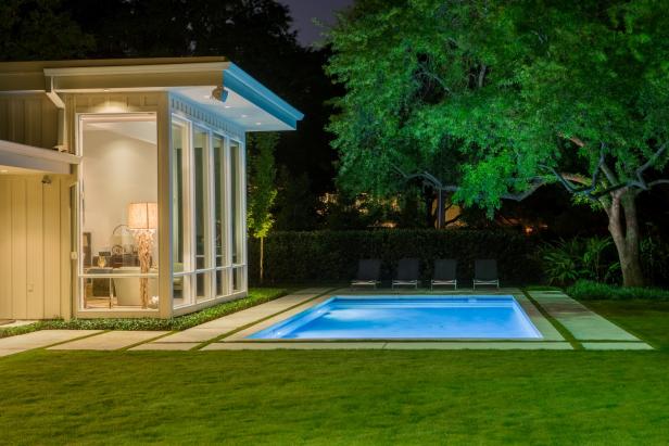 Pool at Night, Light from Living Room Windows Fills Backyard, Trees