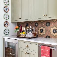 Traditional Butler's Pantry With Grey Cabinets and Mediterranean Tile Backsplash 