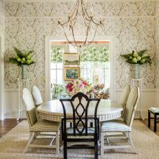 Traditional Dining Room With Floral Wallpaper and Chandelier 