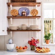 Floating Shelves and Dishes in Traditional White Kitchen 