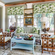 Traditional Sunroom With Blue Wicker Coffee Table and Bent Wood Chairs 