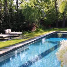 Gorgeous Backyard Swimming Pool With Stone Pavers