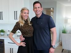 Host Tarek El Moussa (right) and Heather Rae Young (left) stand together in the immaculate Rancho Palos Verdes, CA house, after eagerly waiting for weeks to see the finished product, as seen on Flipping 101 with Tarek El Moussa.