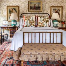 Traditional Bedroom With Damask Wallpaper and White Linens 
