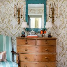 Traditional Wooden Dresser With Teal Antique Mirror and Damask Wallpaper 