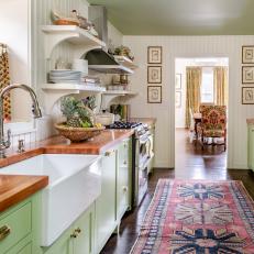 Green and White Traditional Kitchen With Red Persian Runner and Farmhouse Sink 