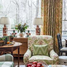 Traditional Living Room With Coffee Table, Chintz Chair and Patterned Curtains 