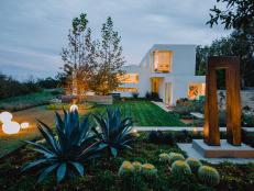 Cacti and Concrete Art in Modern Backyard With Clean Lined Landscaping