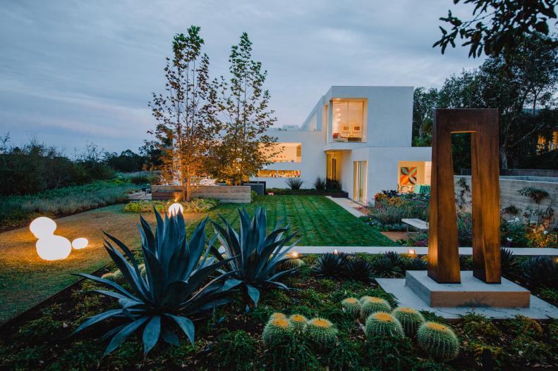 Cacti and Concrete Art in Modern Backyard With Clean Lined Landscaping