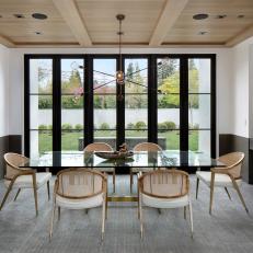 Contemporary Dining Room With Large Glass Doors