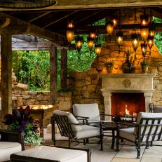 Mediterranean Outdoor Sitting Area WIth Fireplace