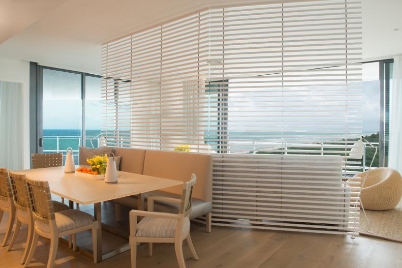 This ocean-view condo includes a living room partition.