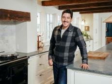 As seen on HGTV's Farmhouse Fixer, Jonathan Knight and his designer Kristina Crestin, work to revitalize farmhouses in the northeast. He poses for a portrait in the renovated kitchen of a farmhouse in Ipswich, Massachusetts.