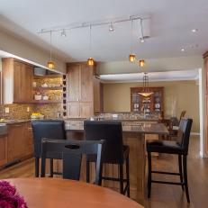 Brown Open Plan Kitchen With Track Lighting