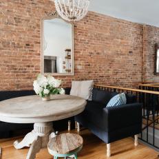 Cozy Dining Room With Exposed Brick Wall