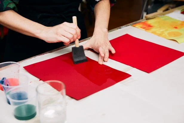 Once the colors are diluted, take a clean foam brush and paint water quickly across the paper horizontally. Tip: You don’t want the paper to peel up.