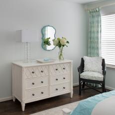 White Dresser and Black Chair