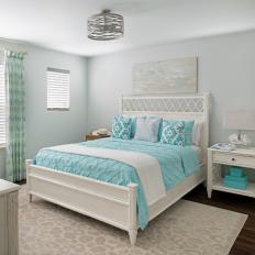 White Coastal Bedroom With Blue Bed Linens