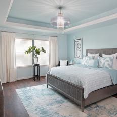 Blue Transitional Bedroom With Chandelier