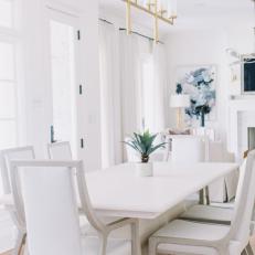 White Transitional Dining Area With Brass Chandelier