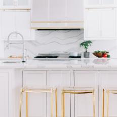 White Transitional Chef Kitchen With Clear Barstools