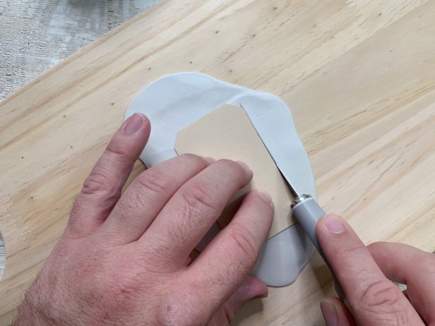 Cut a piece of cardstock into a gift tag shape to use as a template. Place the template on top of the rolled out clay and cut around the edges using a craft knife. Repeat as many times as needed Tip: No craft blade? Use a butter knife!