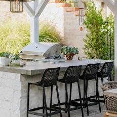 Outdoor Bar With Black Barstools