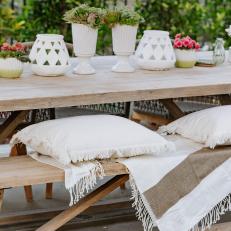 Outdoor Dining Table With White Vases