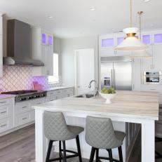 Cool Lighting Gives This White Kitchen Impact