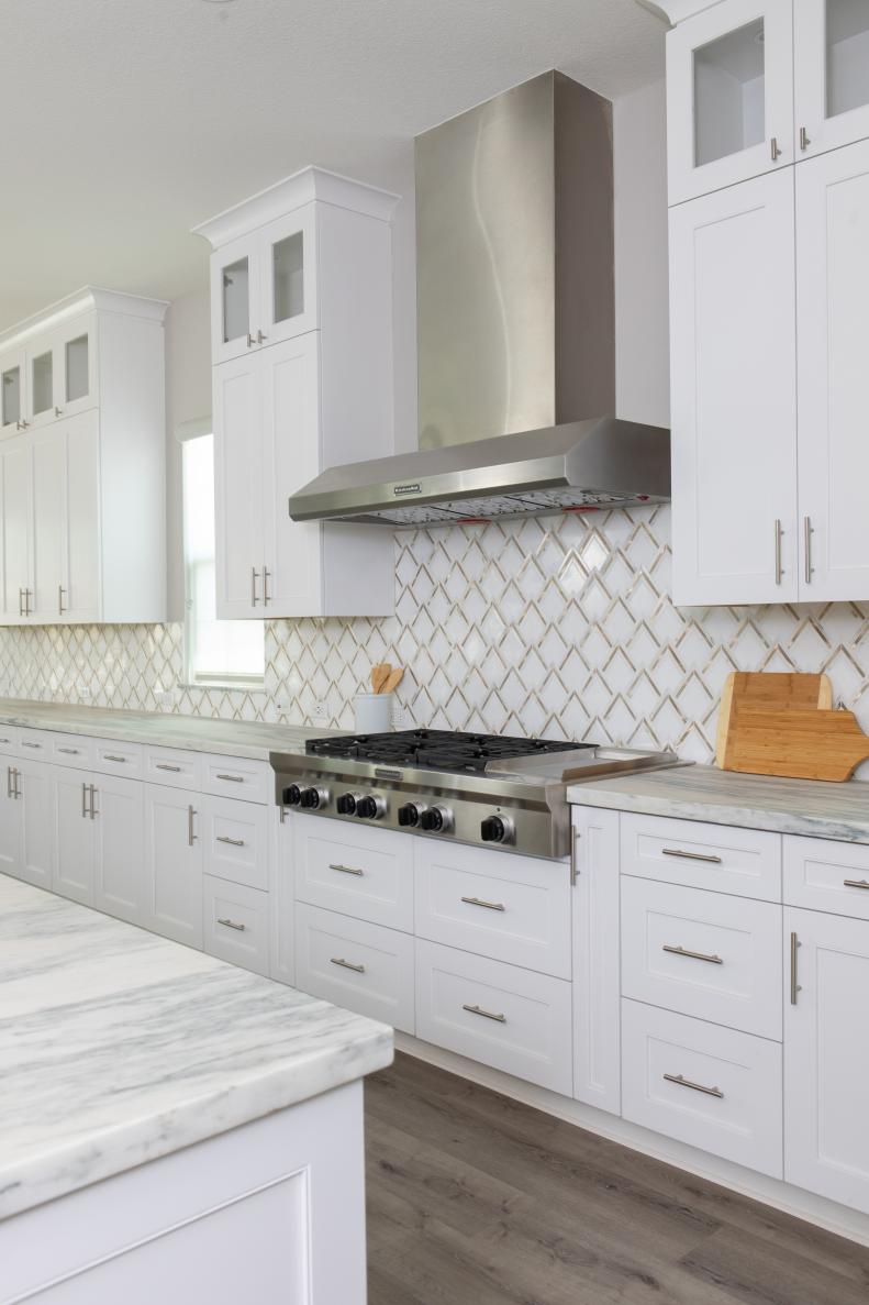 Though the trends are not on view in this particular kitchen, Cailey says "I have been seeing a lot of neutral-toned zellige backsplash and natural wood cabinetry in demand right now."