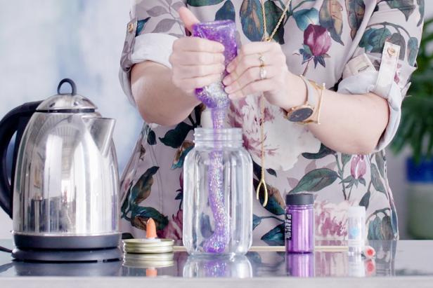 Squeeze an entire bottle of glitter glue into the jar. Stir together with a skewer. This could take a few minutes to fully combine, so be patient while stirring.