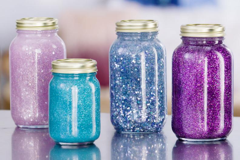 Pink, light blue, dark blue, and purple glitter jars 