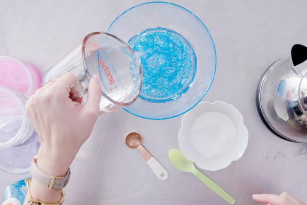Pour the water and borax mixture over the glitter glue and let sit for 30 seconds.