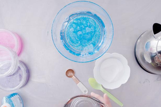 Pour the water and borax mixture over the glitter glue and let sit for 30 seconds.