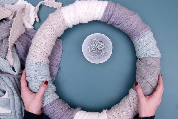 Repeat with all of your fabric until the wreath is covered, overlapping the strips to create a warm and cozy texture.