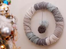 Don’t throw away your old, worn-out sweaters. Make a big mug of hot cocoa for a crafty night in and turn them into a cozy DIY upcycled sweater wreath for the holiday and winter season.