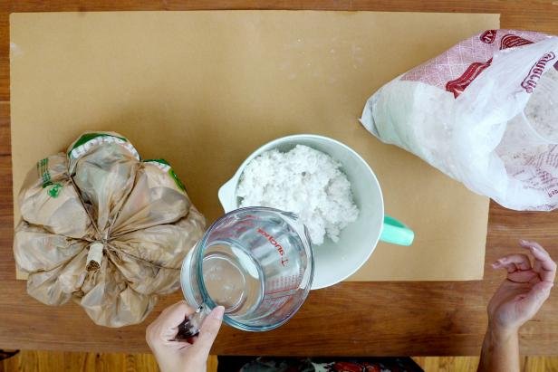 Scoop some paper mache pulp into a bowl and add water. Mix together until the paper mache sticks to itself and you can form shapes.